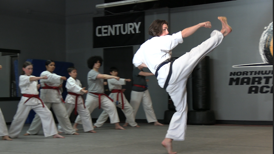 Local karate studio breaks boards and barriers
